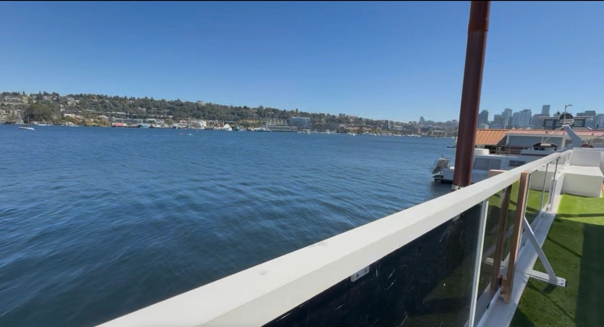 Wide view across Lake Union toward the Seattle skyline from the Banya Boat upper deck